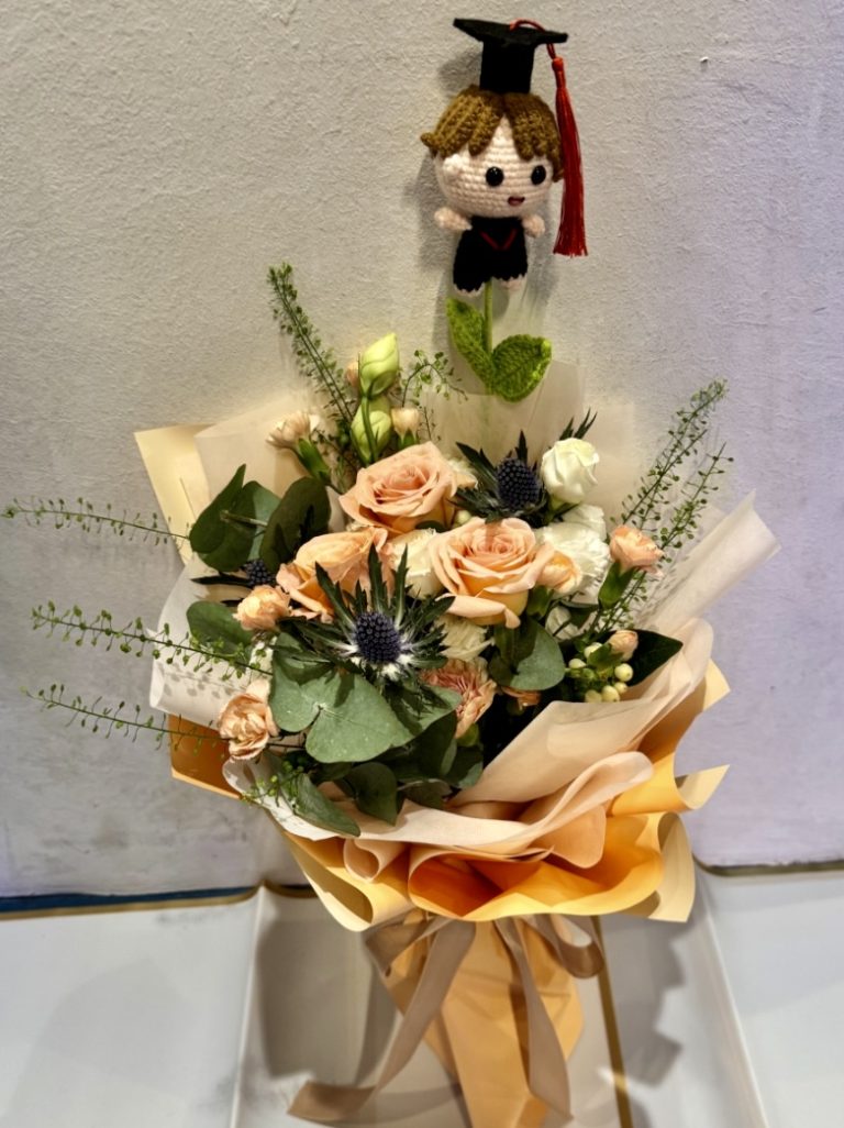 Champagne roses complement with seasonal fillers with one crocheted ...